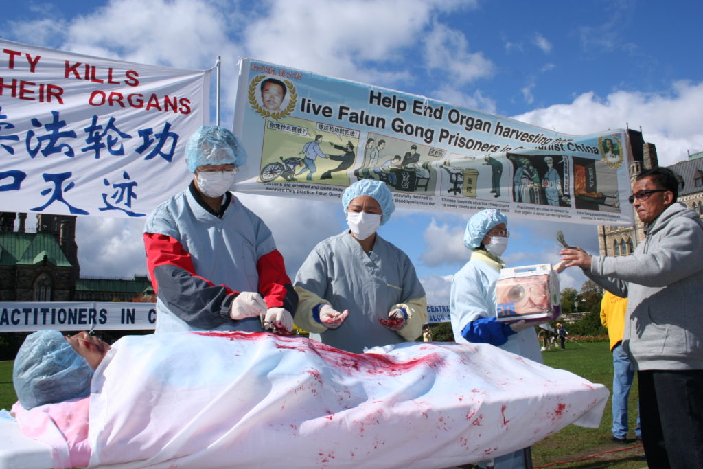 A re-enactment of organ harvesting in China on Falun Gong practitioners, during a rally in Ottawa, Canada, in 2008. (Epoch Times) 