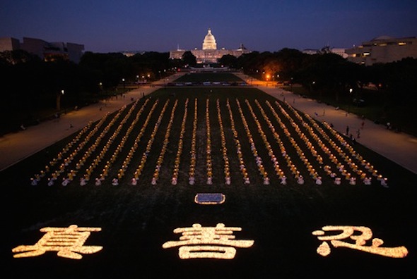 Candlelight vigil on the Washington Monument grounds on July 17 – the Chinese characters are Truthfulness-Compassion-Forbearance.