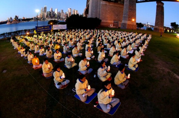 Falun Gong practitioners hold a candlelight vigil in Sydney July, 20134 to mark the 14th anniversary of the beginning of the Falun Gong persecution. Photo: Getty Images