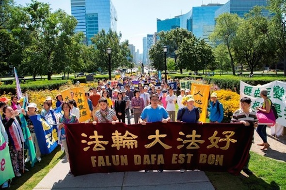 More than 1,000 practitioners participated in the rally and parade in Toronto on August 24, 2014.