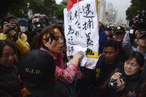 Zhang Xiuyue, a pro-China activist in Taiwan, screams outside the Legislative Yuan on April 1. (J. Michael Cole)